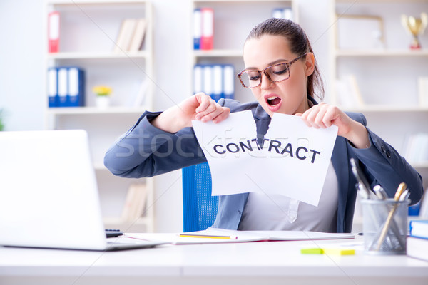 Businesswoman tearing apart her contract Stock photo © Elnur