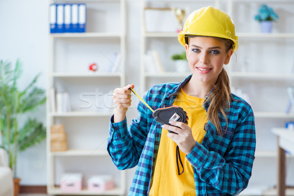 Woman in workshop with measuring tape Stock photo © Elnur