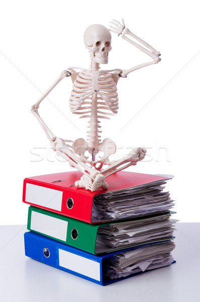 Skeleton with pile of files on white Stock photo © Elnur
