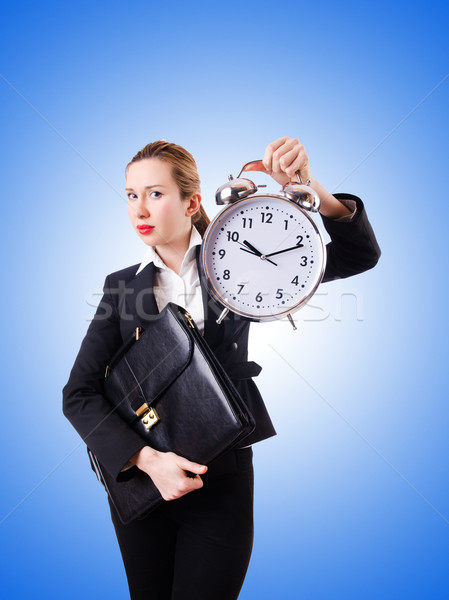 Woman businesswoman with giant clock Stock photo © Elnur