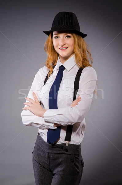 Stock photo: Pretty girl wearing black and white clothing isolated on gray