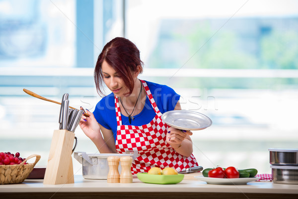 Woman preparing soup in the kitchen Stock photo © Elnur