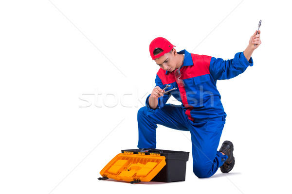 Young repairman with wrench spanner isolated on white Stock photo © Elnur