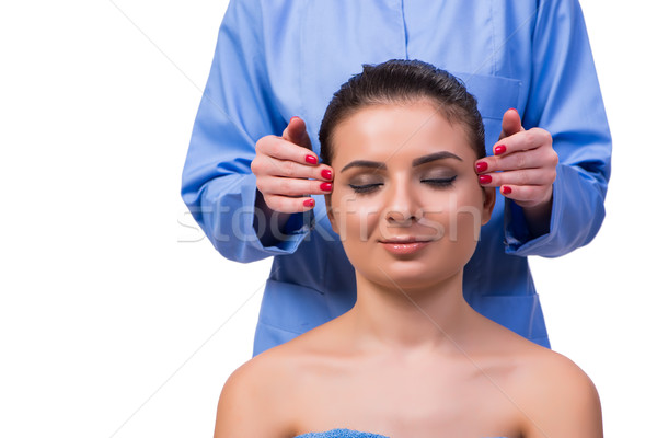 Stock photo: Beautiful young woman during face massage session