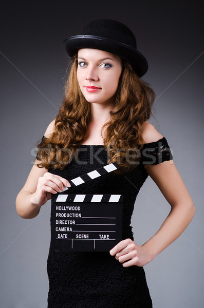 Woman with movie clapper board Stock photo © Elnur