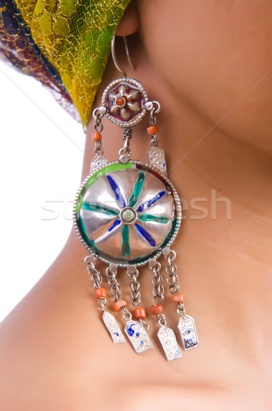 Stock photo: Woman showing off her earrings