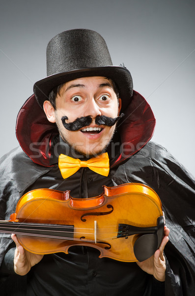 Funny violin player wearing tophat Stock photo © Elnur