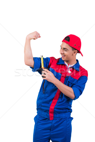 Young repairman measuring his biceps isolated on white Stock photo © Elnur