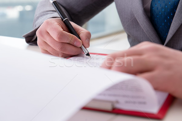 Stock photo: Businessman taking notes at the meeting