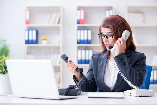 Frustrated call center assistant responding to calls Stock photo © Elnur