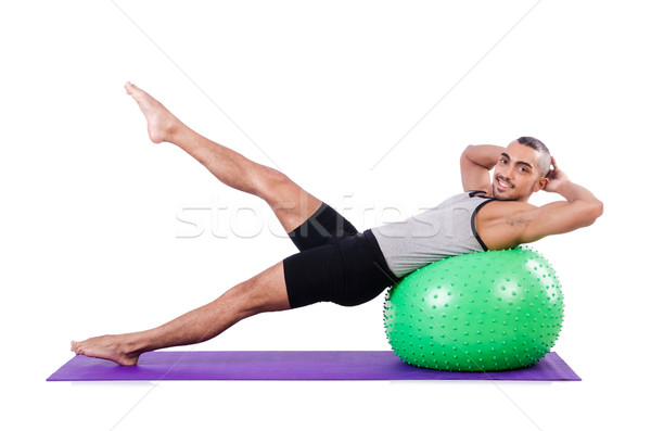 Man with swiss ball doing exercises on white Stock photo © Elnur