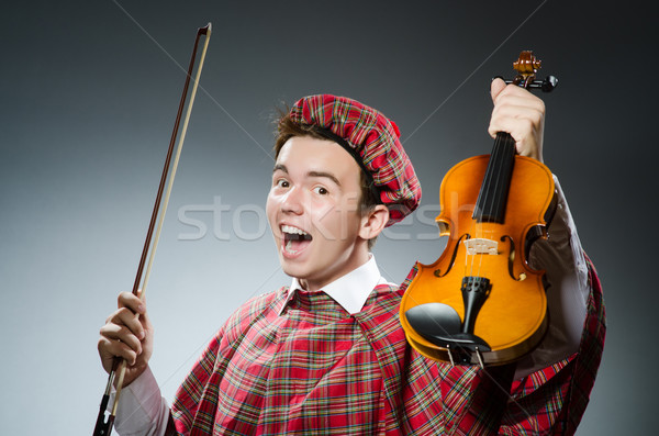 Funny scotsman with violin fiddle Stock photo © Elnur