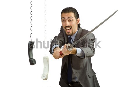 Young businessman holding a tool isolated on white Stock photo © Elnur