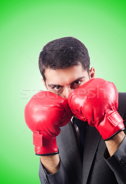 Young businessman with boxing gloves Stock photo © Elnur