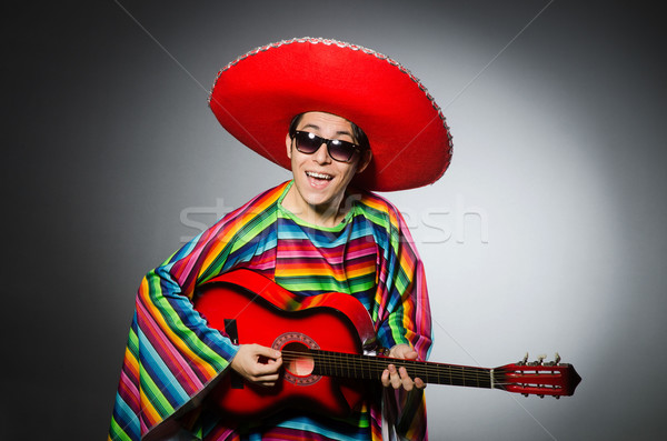 Man in red sombrero playing guitar Stock photo © Elnur