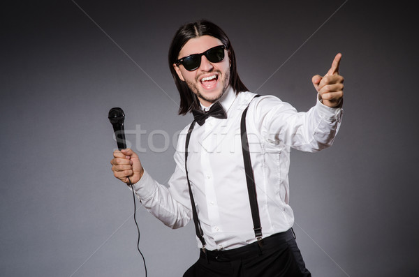 Funny singer with microphone at the concert Stock photo © Elnur