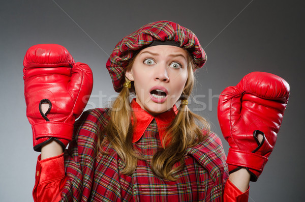 Woman in scottish clothing in boxing concept Stock photo © Elnur