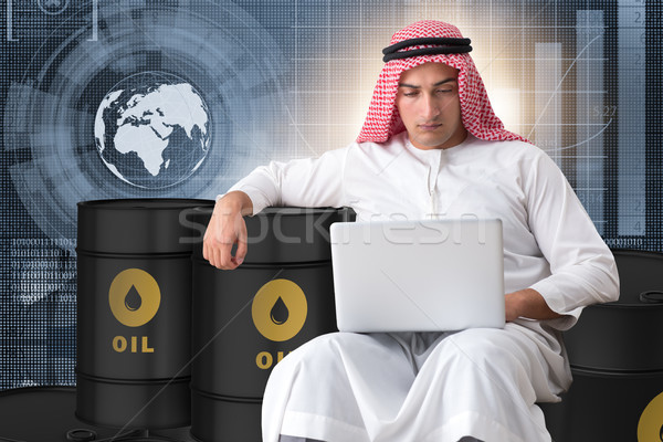 The arab businessman trading crude oil on laptop Stock photo © Elnur