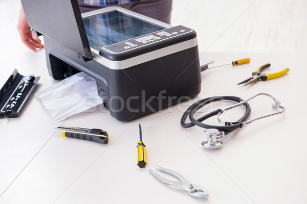 Repairman repairing broken color printer Stock photo © Elnur