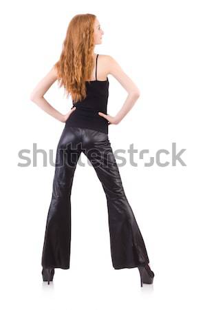 Redhead woman in black bell bottom pants on white Stock photo © Elnur