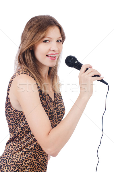 Stock photo: Woman singer with microphone on white