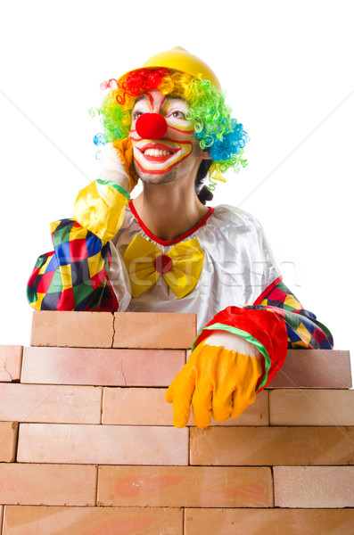 Bad construction concept with clown laying bricks Stock photo © Elnur