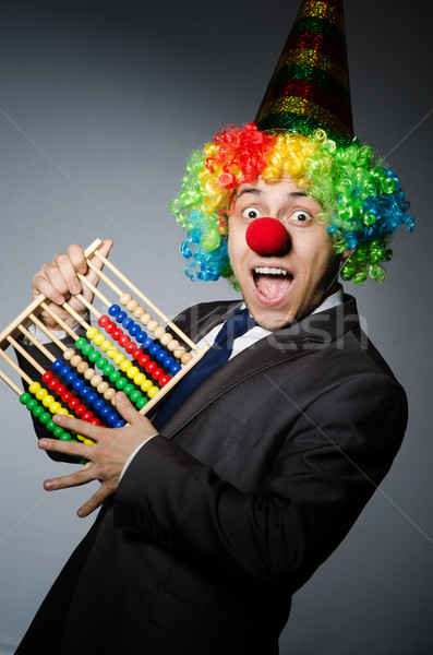 Funny clown businessman with abacus Stock photo © Elnur