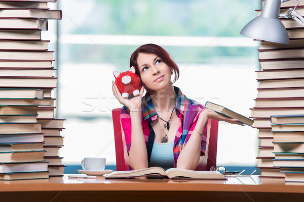 Concept of expensive textbooks with female student Stock photo © Elnur