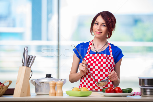 Woman preparing soup in the kitchen Stock photo © Elnur