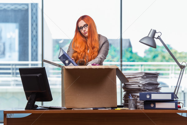 Red head woman moving to new office packing her belongings Stock photo © Elnur