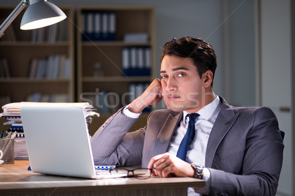 The businessman staying in the office for long hours Stock photo © Elnur
