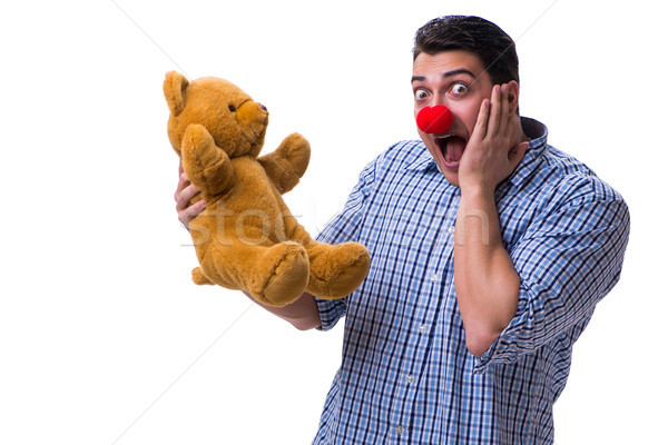 Funny clown man with a soft teddy bear toy isolated on white bac Stock photo © Elnur
