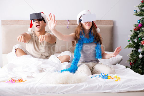 Happy couple celebrating christmas holiday in bed Stock photo © Elnur