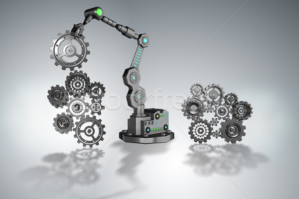 Robot putting cogwheels in connection Stock photo © Elnur