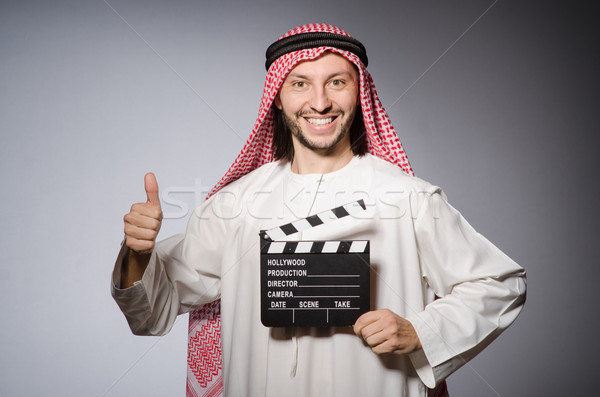 Arab with movie clapper board Stock photo © Elnur