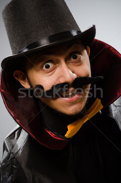 Funny magician man wearing tophat Stock photo © Elnur