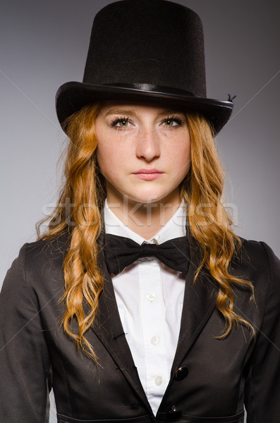 Pretty girl wearing retro hat isolated on gray Stock photo © Elnur