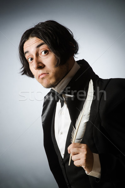 Funny writer with quill in vintage concept Stock photo © Elnur