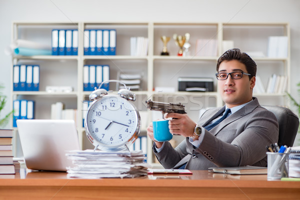 Young businessman in time management concept Stock photo © Elnur