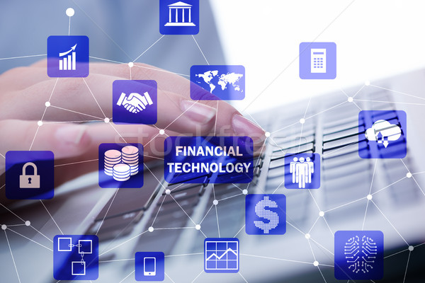 Hands working on laptop in financial technology fintech concept Stock photo © Elnur