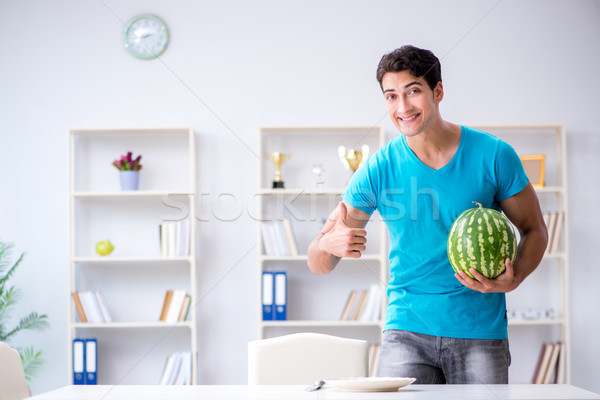 Człowiek jedzenie arbuz domu wody uśmiech Zdjęcia stock © Elnur
