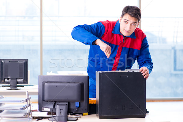 Computer repairman specialist repairing computer desktop Stock photo © Elnur