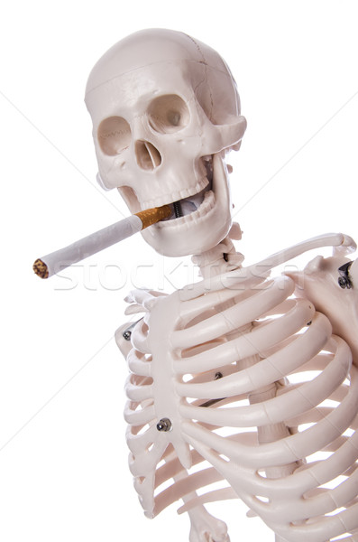 Skeleton smoking cigarette isolated on white Stock photo © Elnur