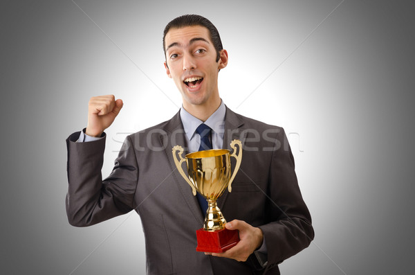 Man being awarded with golden cup Stock photo © Elnur