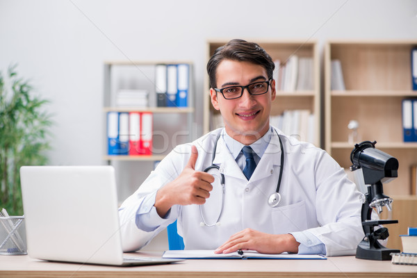 Young adult doctor with laptop computer Stock photo © Elnur