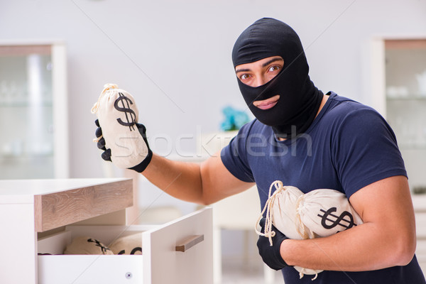 Robber wearing balaclava stealing valuable things Stock photo © Elnur