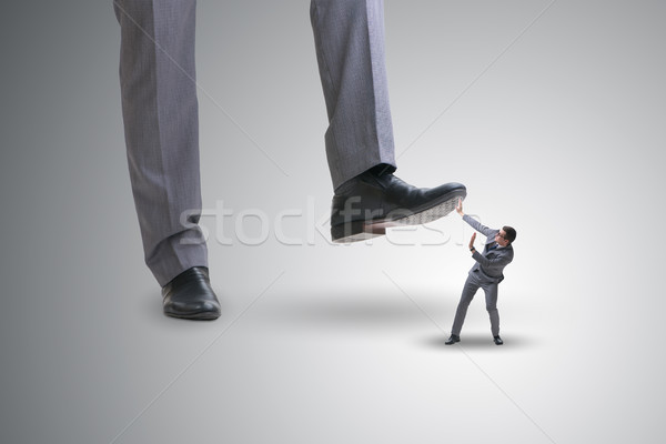 Bad angry boss stamping on employee in business concept Stock photo © Elnur