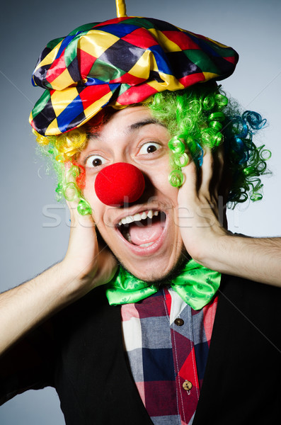 Funny clown against the dark background Stock photo © Elnur