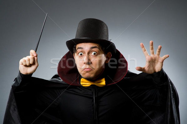 Funny magician man with wand and hat Stock photo © Elnur