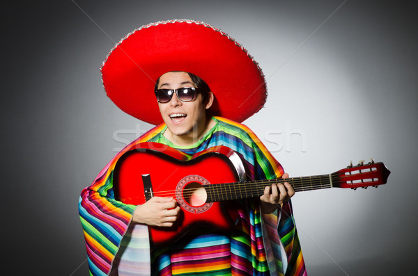 Man in red sombrero playing guitar Stock photo © Elnur